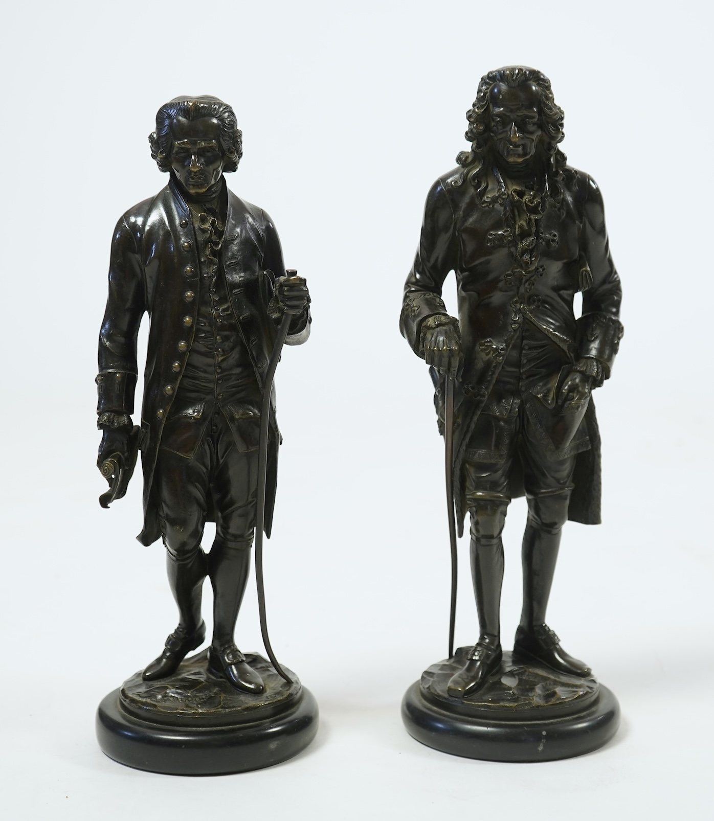 After Jean-Claude-Joseph Rosset (1706-1786), two patinated bronze figures of Voltaire and Jean-Jacques Rousseau, 19th century